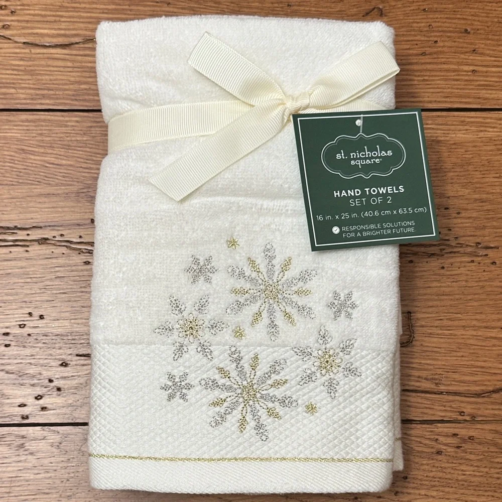 St. Nicholas Square Cream Towels with Silver and Gold Snowflakes